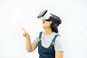 Asian girls are excited about the VR experience alone on white,  online education, education, gadgets, technology, and video game concepts. photo