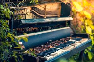 old piano in the garden.soft focus.vintage style. photo