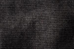 Grey cotton texture background. Detail of sweater fabric surface. photo
