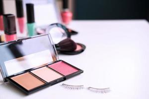 Woman cosmetics, brush and make up on dressing table at home photo
