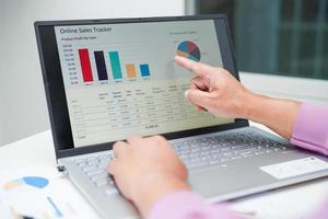 Businessman working and analysis with statistic graph in office. photo