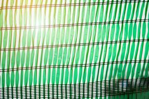 Green Shading Net for protect sun light with tree leaves shadow photo