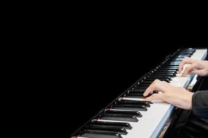 Close up musician hand playing piano photo