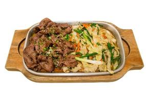 Beef with vegetables on hot plate photo