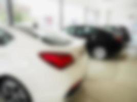 blur photo of new car at car showroom
