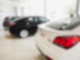 blur photo of new car at car showroom