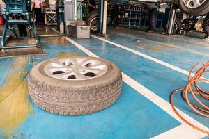 auto tire replacement at car service centre repair shop photo