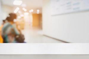 blur hospital interior background with wood counter photo