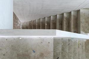 New house construction with concrete staircase at building site photo