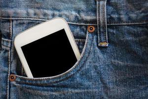 mobile phone in jeans pocket with black screen photo