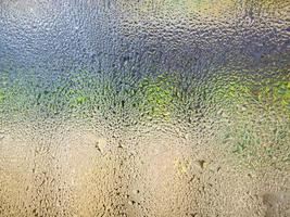 water drops on supermarket refrigerator glass photo