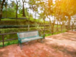 blur bench in the park summer time natural background photo