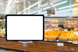 Supermarket grocery store abstract blur background with blank price board photo