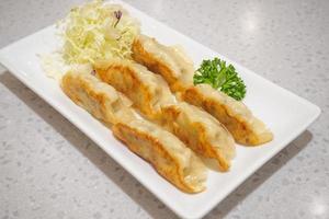 Gyoza dumplings with vegetables photo