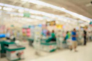Supermarket store blur background ,Cashier counter with customer photo