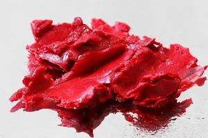 Red lipstick texture smudge, cosmetic sample photo