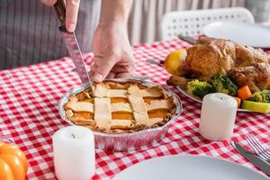 woman preparing thanksgiving dinner at home kitchen photo