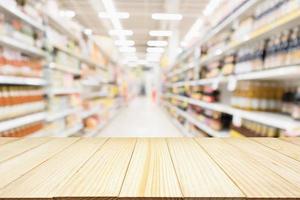 Abstract blur supermarket discount store aisle and product shelves interior defocused background photo