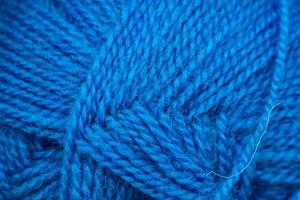 Texture of blue soft woolen threads for knitting. photo