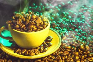 Coffee cup and coffee beans on table background. Top view with copy space for your text photo