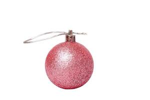 New Year concept. Toy with glitter layer pink on Christmas tree isolate on white. photo