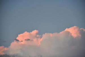 Evening storm clouds illuminated by the evening sun photo