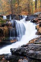 Autumn Waterfall in mountain photo