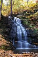 Autumn Waterfall in mountain. photo