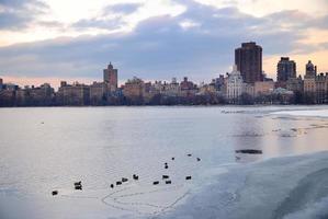 Central Park lake with New York City Skyline photo