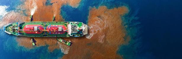 Oil leak from Ship , Oil spill pollution polluted water surface. water pollution as a result of human activities. industrial chemical contamination. oil spill at sea. petroleum products. photo