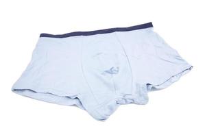 Light blue underpants and clothing isolated on white background. photo