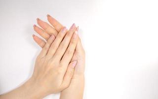 Female nail weakness damage from gel polish coating, Finger nail manicure. photo
