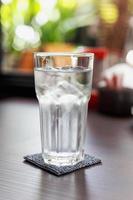 Glass of cold drinking water photo