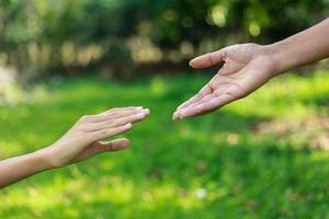 A man giving helping hand to another photo