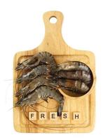 Top view of shrimp on wood photo