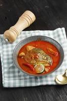 Salmon Fish Head Curry or Gulai Kepala Ikan Padang photo