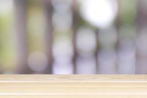 Empty wooden table with light bokeh in garden space background montage style, For place the product. photo