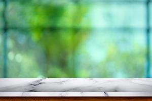 Empty white marble table with blur cafe background. photo