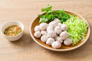 pork meatball with vegetable and spicy sauce photo