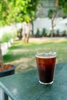 iced americano coffee glass on table photo