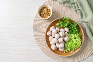 pork meatball with vegetable and spicy sauce photo