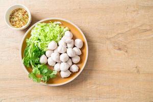 pork meatball with vegetable and spicy sauce photo