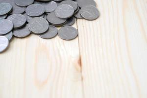 coins on wooden table photo