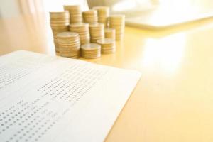 Coin stacks and savings account passbook photo