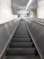 Modern escalator and staircase in subway station photo