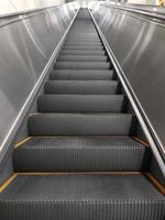 Modern escalator and staircase in subway station photo