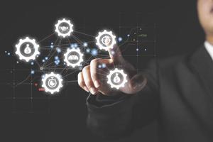 Robotic process automation of business workflows with a businessman in background touching a button photo