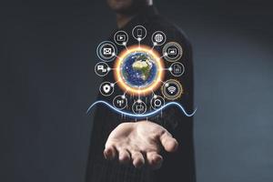 People and Network connection concept. Businessman leading the global connection with connecting people orbit around the world. photo