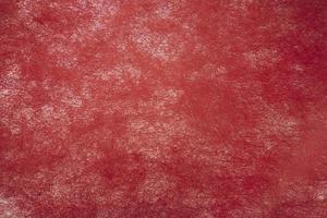Red textured background with a gradient photo
