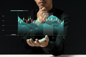 young investor or business man with graphic global network connection and graph chart of stock market investment trading photo